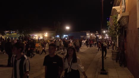 Thriving-tourist-corridor-in-Oaxaca-City-bustling-with-people-at-night