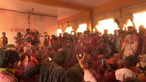 pov-shot-men-are-shooting-videos-and-taking-photos-on-mobile-phones-Ghumar-dance-is-going-on-inside-the-temple