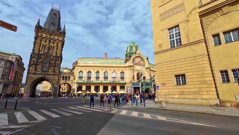 People-walking-on-Prague-Republic-square-along-Powder-tower-gate