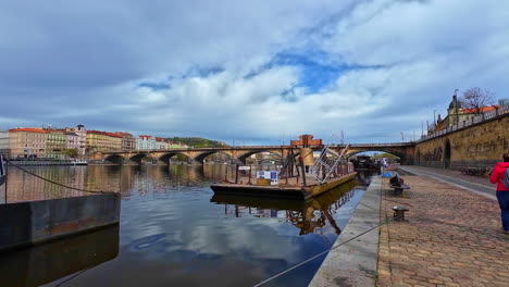 Slow-motion-shot-of-an-old-stone-path-leading-up-to-the-Charles-Bridge-in-Prague,-Czech-Republic-on-a-cloudy-day