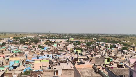 pov-shot-showing-many-residential-houses-and-a-temple