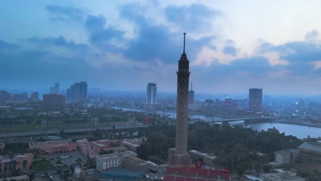 Aerial-of-the-Cairo-Tower,-a-prominent-modern-landmark-in-Cairo,-graces-the-Gezira-district-on-Gezira-Island-in-the-River-Nile,-near-downtown-Cairo,-Egypt