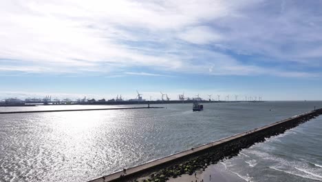 Hoek-van-Holland,-Netherlands---The-NCL-Svelgen-Navigating-Through-the-Ship-Canal---Aerial-Drone-Shot