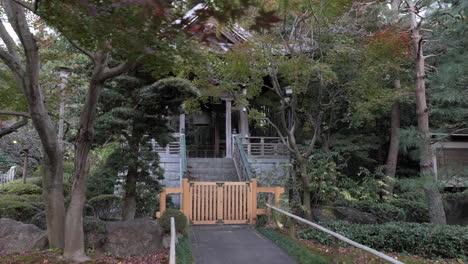 Typical-Buddhist-bell-in-a-temple-in-Tokyo,-visitors-hit-it-asking-and-then-make-a-wish