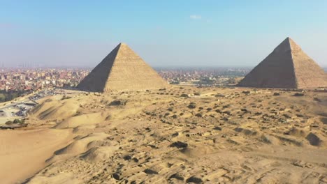 The-aerial-view-of-the-Great-Pyramids-of-Giza,-the-Pyramids-Plateau,-in-Egypt,-epitomizes-the-timeless-allure-of-ancient-wonders-and-the-rich-cultural-heritage-of-civilization