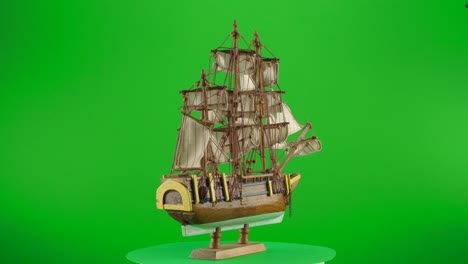Scale-wooden-model-Ship-HMS-Bounty-Vessel-British-Royal-Navy-Command-by-William-Bligh-in-a-turntable-with-green-screen-for-background-removal