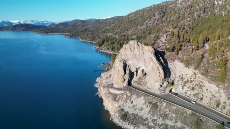 Drone-view-of-Cave-Rock-roadway-along-Lake-Tahoe-coasltine,-California