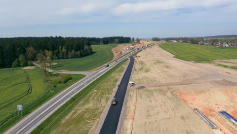 New-highway-road-under-construction,-industrial-scene,-Aerial-drone-view