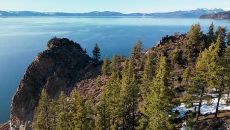 Aerial-orbit-of-Cave-Rock-cliff,-Lake-Tahoe,-California