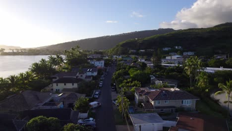 drone-footage-thru-the-coastal-region-of-Honolulu-Hawaii-showing-the-residential-and-commercial-areas-nestled-within-the-lush-mountains