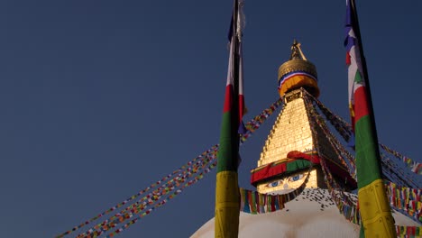 Low-view-looking-up-to-the-central-Stupa-of-Boudhanath-Temple,-Kathmandu,-Nepal