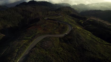 Car-Driving-on-Scenic-Curvy-Road-Above-the-Clouds-at-Sunset,-Madeira-4k
