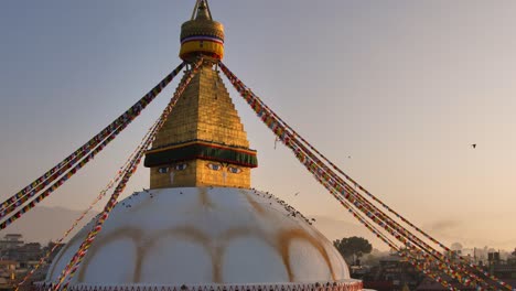 Wide-shot-of-central-Stupa-at-sunset,-Boudhanath-Temple,-Kathmandu,-Nepal