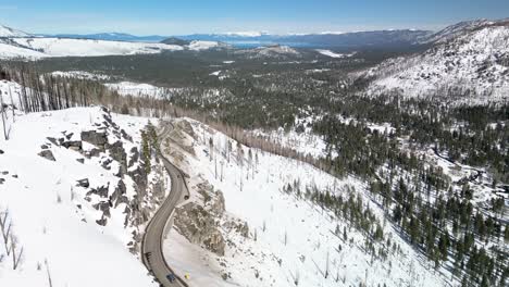 Aerial-view-of-snowy-mountainside-highway-in-Lake-Tahoe,-California