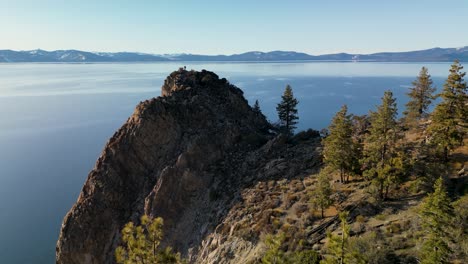 Aerial-view-of-Cave-Rock-sillhousette-on-Lake-Tahoe,-California