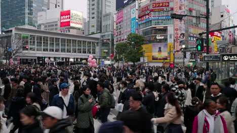 Person's-POV-Walking-Among-The-Crowd-At-Shibuya-Crossing-In-Shibuya,-Tokyo,-Japan