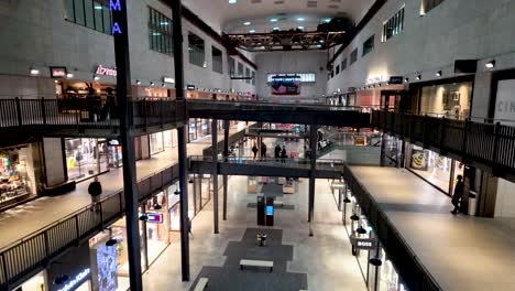 Inside-View-Of-The-Turbine-Hall-within-Battersea-Power-Station,-London,-array-of-shops