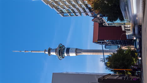 The-Sky-Tower-telecommunications-and-observation-tower-in-Auckland,-New-Zealand---vertical-daytime-time-lapse