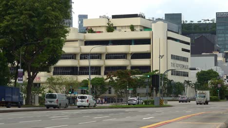 Commuting-traffics-on-New-Bridge-Road-and-Eu-Tong-Sen-Street-featuring-The-riverwalk-building-complex-at-downtown-Singapore-at-daytime