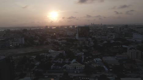 Drone-tracks-sunset-over-Lagos,-Nigeria