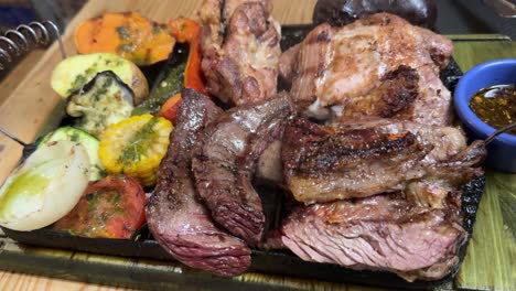 Steam-coming-out-freshly-cooked-plate-of-mixed-meat-and-vegetables-high-end-restaurant