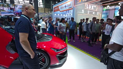 Visitors-take-photos-next-to-new-GAC-Hyper-SSR-sports-electric-super-car