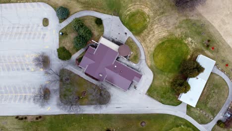 aerial-flyover-of-a-large-parking-lot-with-trees-and-landscaping