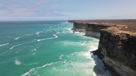 Drone-aerial-moving-forward-and-down-into-the-Great-Australian-Bight-showing-crashing-waves