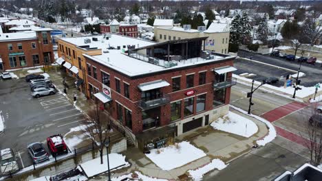 aerial-pan-around-a-downtown-shop-in-a-town