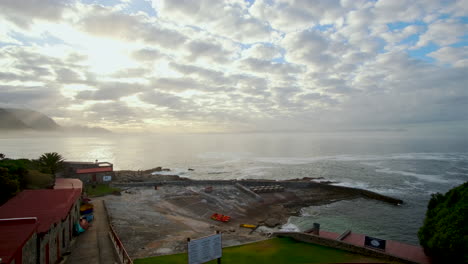 Scenic-sunrise-over-Walker-Bay-with-view-over-historic-Old-Harbour-of-Hermanus