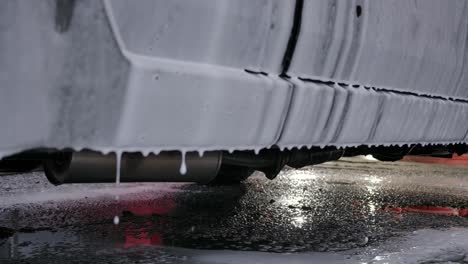 Soap-Suds-Dripping-From-Side-Of-Car-During-Car-Wash---Close-Up