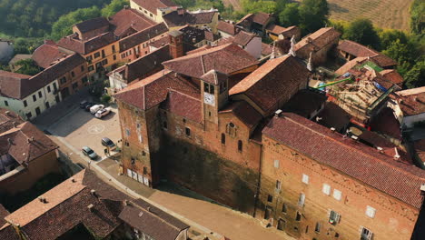 Aerial-view-around-the-Church-of-Saint-Lawrence,-golden-hour-in-Scurzolengo,-Italy