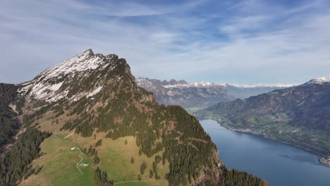 Snow-Dusted-Peak-by-Lake-Walensee,-Switzerland---aerial-panoramic