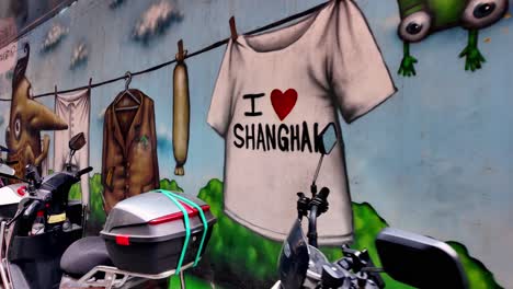 Watch-a-vibrant-graffiti-that-shouts-'I-Love-SHANGHAI'-in-the-trendy-Tianzifang-area,-capturing-the-city's-spirit