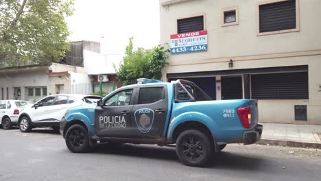 Argentine-blue-police-truck-with-stop-lights-parked-in-city-streets-buenos-aires