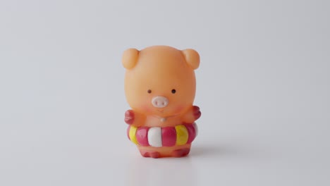 Hand-Picking-Up-Cute-Miniature-Pig-Toy