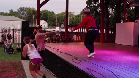 A-drag-king-gets-tips-from-audience-members-during-the-MidMo-Pride-Festival