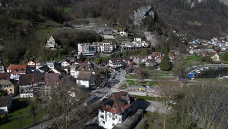 Drone-clip-showing-traditional-white-buildings-in-Swiss-alpine-village