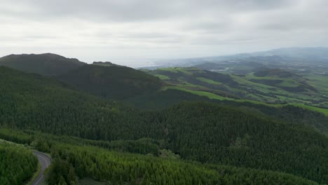 Gaze-upon-the-lush-forest-landscapes-of-Portugal's-Azores-region-from-above,-you'll-capture-the-essence-of-exploration-and-discovery