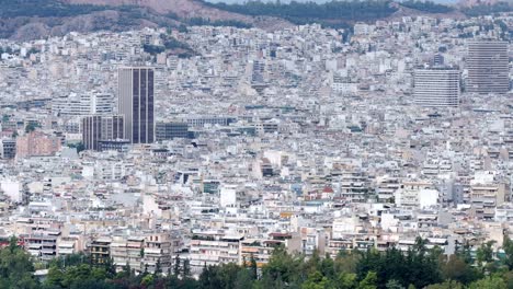 Teleobjetivo-Aéreo-Del-Centro-De-La-Ciudad-De-Atenas,-Vista-Panorámica-De-La-Ciudad-Del-Edificio-Alto