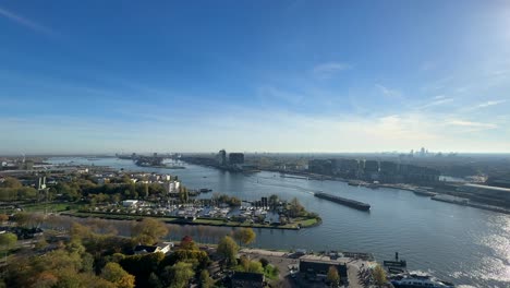 Aerial-cityscape-of-Amsterdam-in-Netherlands-with-blue-sky-and-water