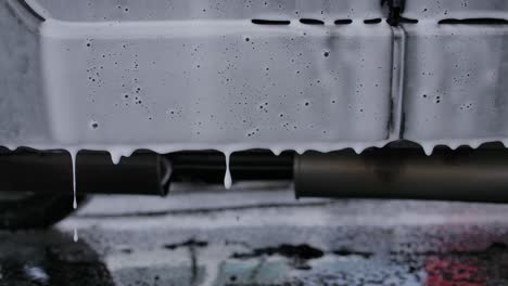 Soap-Suds-Dripping-From-Side-Exterior-Of-Car-At-Carwash