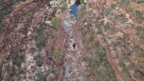 Drone-aerial-panning-down-over-an-Australian-gorge-and-national-park-with-a-river-flowing