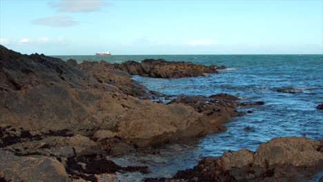 Wde-shot-of-waves-was-they-violently-crash-on-rocks-on-the-Irish-coastline