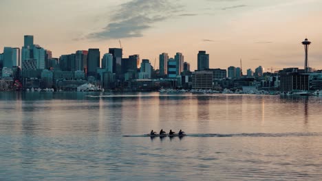 Silhouetted-Rowers-at-Sunset-on-Lake-Union-with-Seattle-Skyline