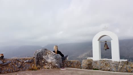 Hiker-Sits-on-Mountain-Top-and-Enjoys-Epic-360-Degree-Viewpoint---Greek-Island-of-Crete