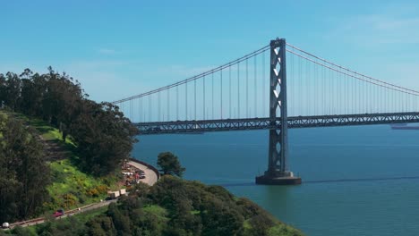 Telephoto-cinematic-drone-shot-of-the-Oakland-Bridge-with-traffic