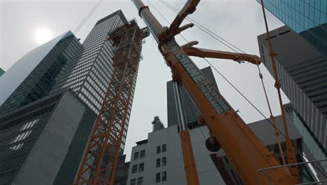 A-low-angle-shot-of-a-crane-on-the-street-in-New-York-City-on-a-cloudy-day