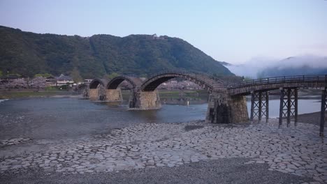 Kintai-Kyo-in-the-morning,-mist-on-the-mountains-of-Iwakuni-Japan