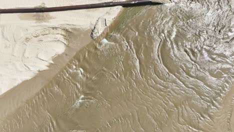 Water-lapping-against-the-newly-dredged-shoreline-of-Lake-Michigan